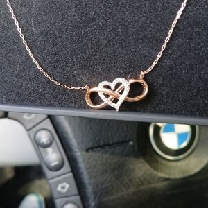 Yellow gold necklace 10 karat , infinity symbol with diamond heart